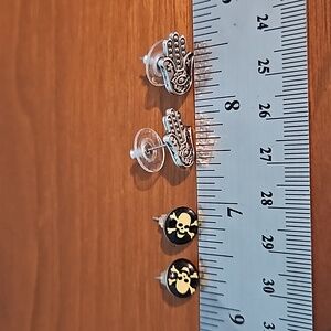 2 pair earrings (skull cross bones and hand)